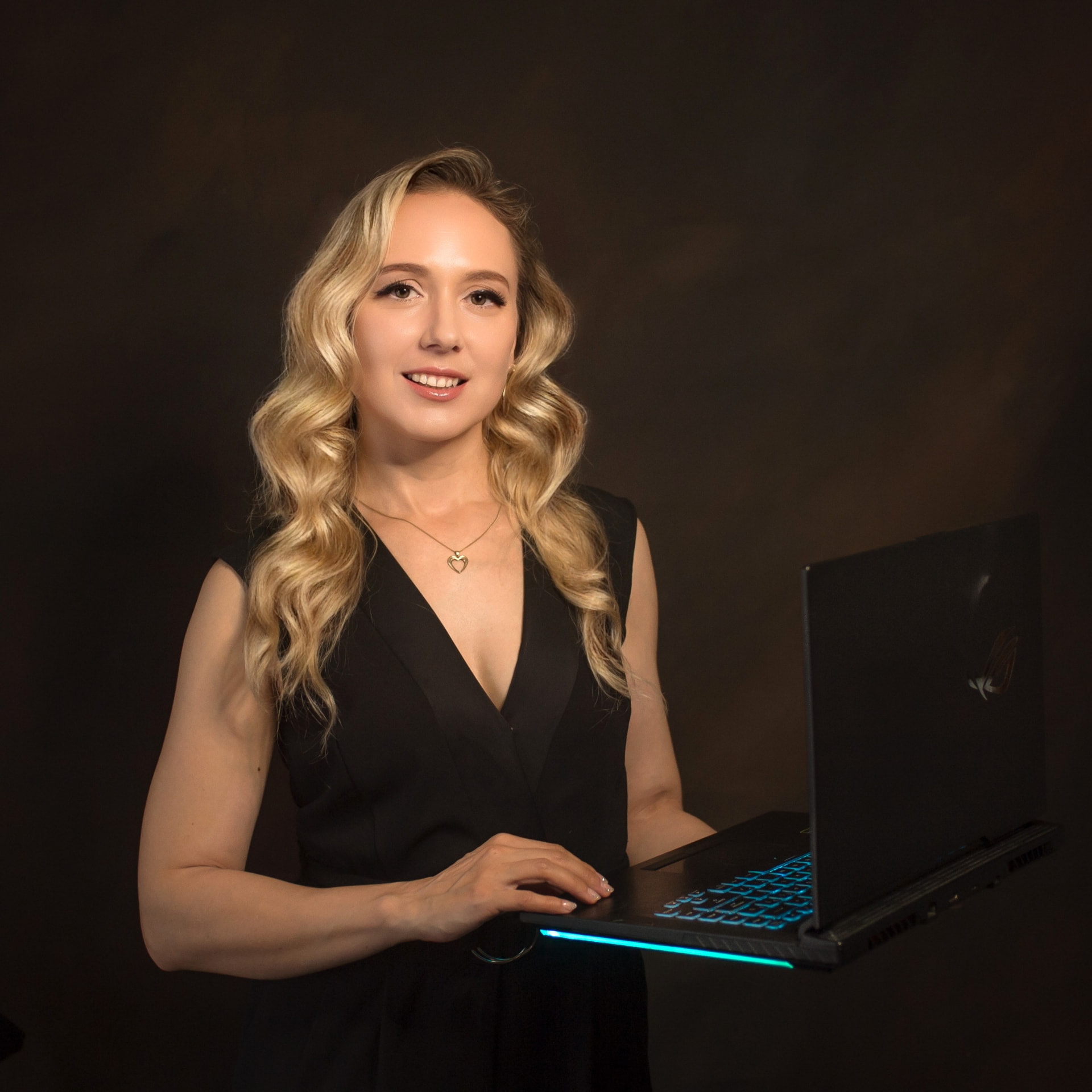 Bogdana holding a laptop